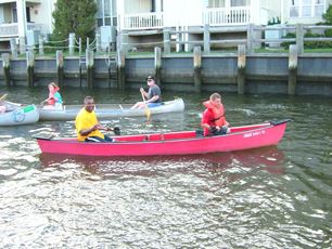 The canoes drift along